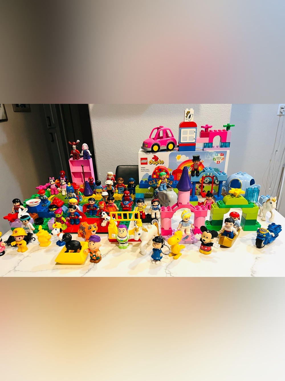 LEGO DUPLO and Fisher-Price Little People toys, primarily featuring Disney
